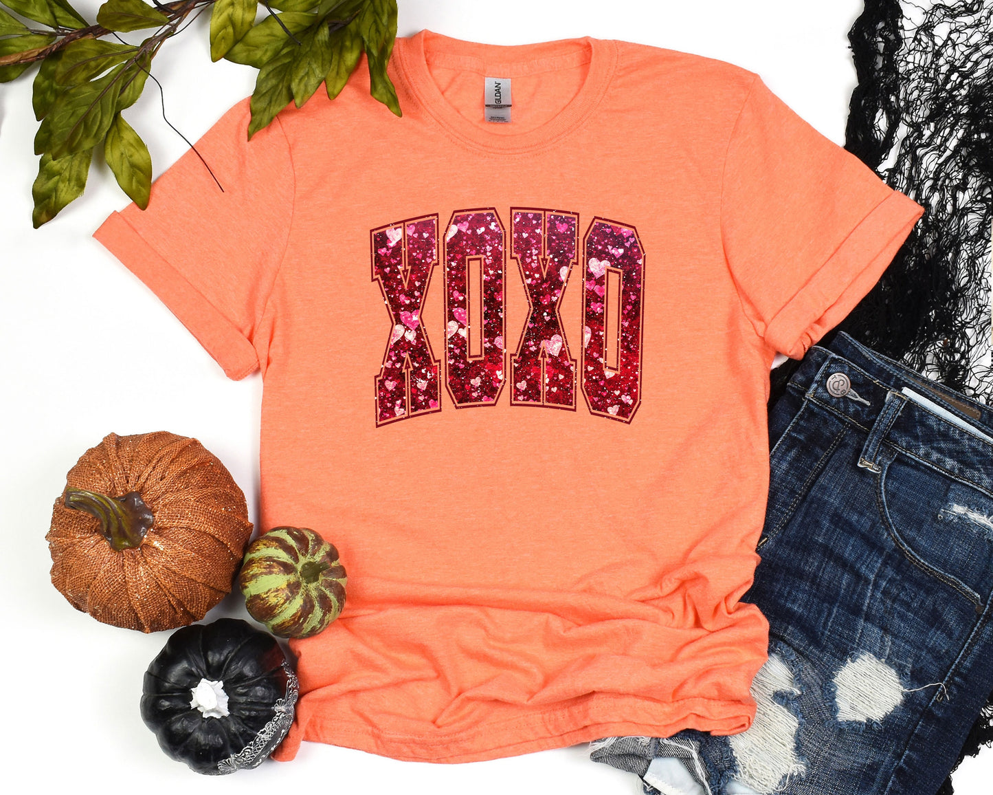 a t - shirt with the word dad written in sequins