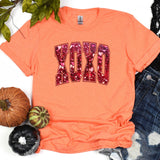 a t - shirt with the word dad written in sequins