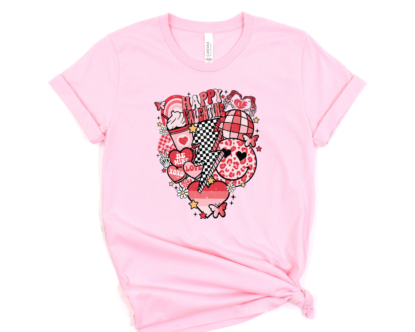 a pink t - shirt with a picture of a heart on it