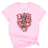 a pink t - shirt with a picture of a heart on it
