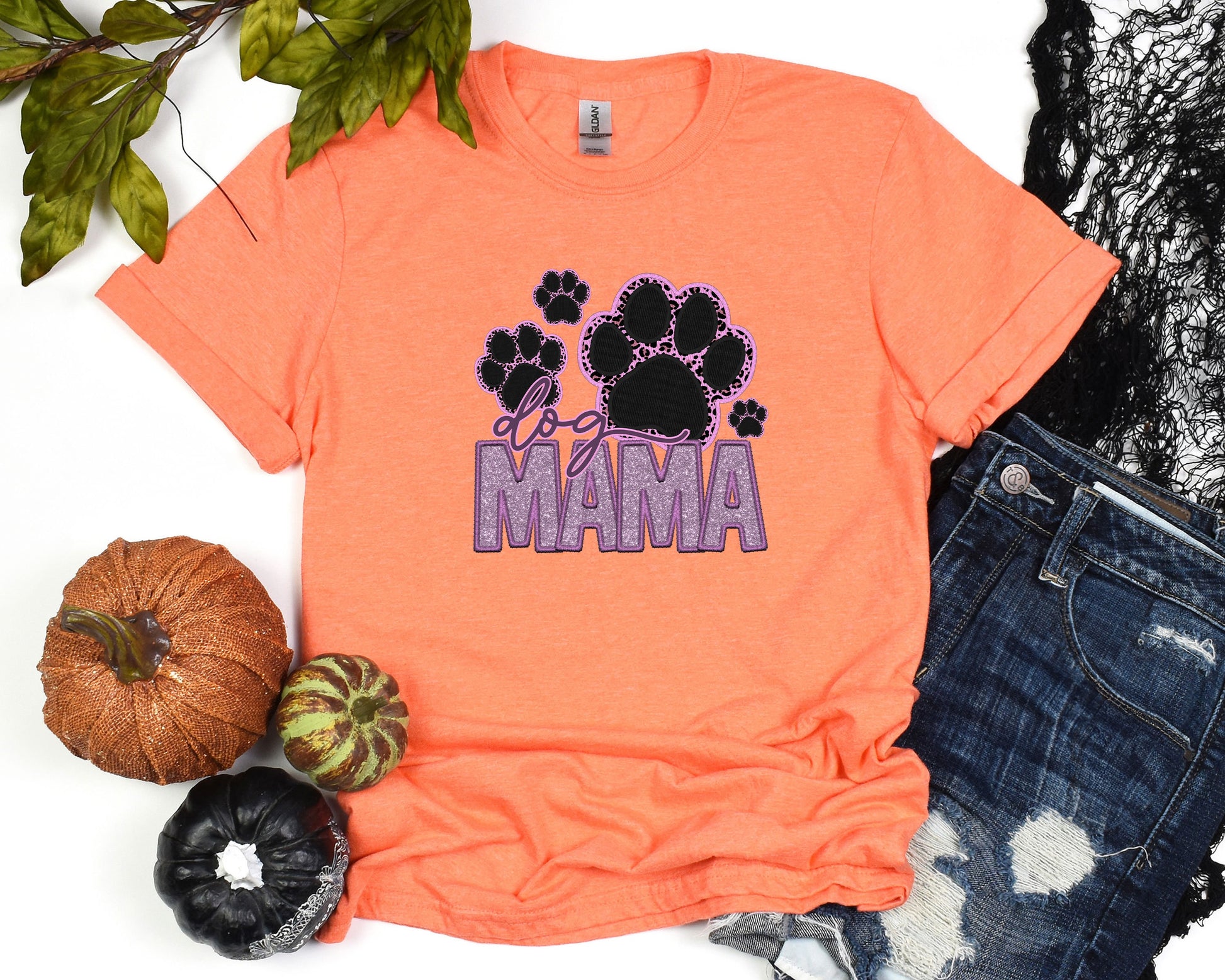 a shirt that says mama with paw prints on it