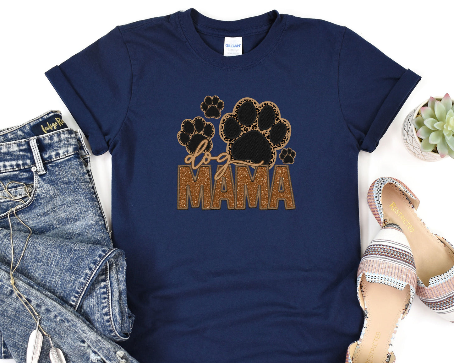 a t - shirt that says mama with a paw print on it