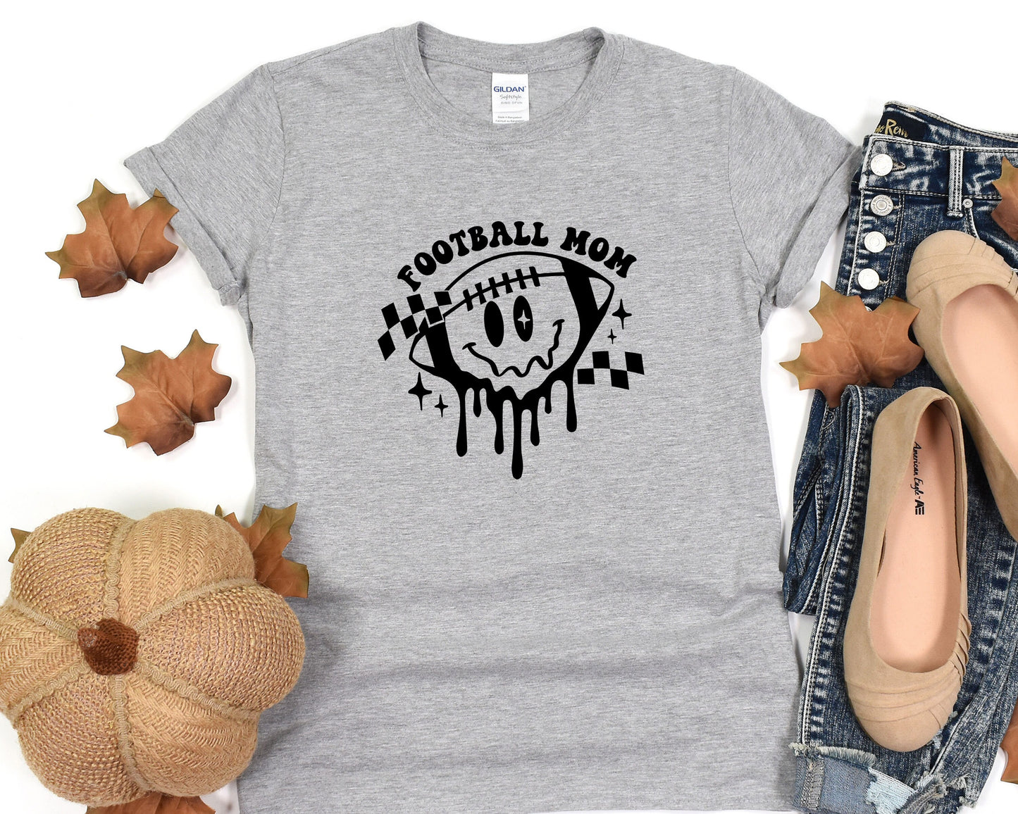 a t - shirt that says football now with a skull on it