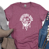 a t - shirt that says basketball man on it next to a pair of jeans
