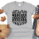 a women's t - shirt with the words besties on it