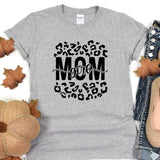 a woman's t - shirt with the word mom printed on it