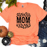 a t - shirt with the word mom printed on it