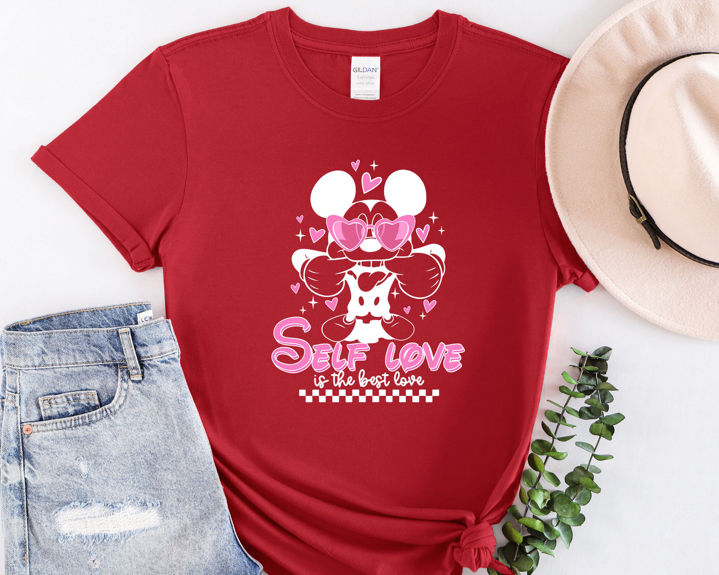 a red shirt with a minnie mouse graphic on it