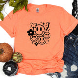 a t - shirt that has a smiley face on it