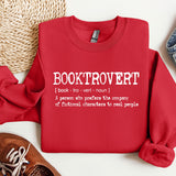 a red shirt that says booktrover next to a pair of shoes