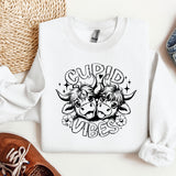 a pair of shoes, a pair of jeans, and a sweatshirt on a table