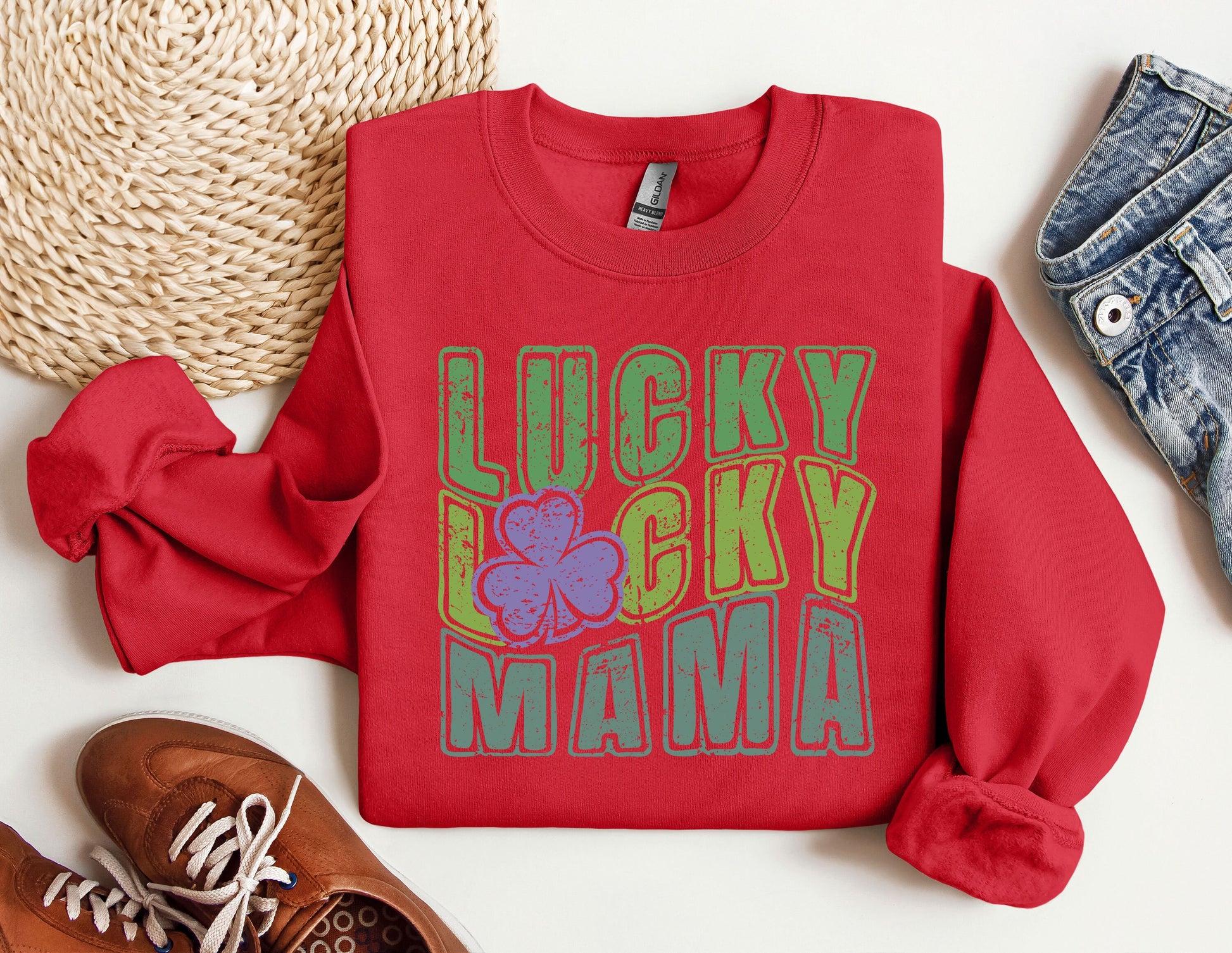 a red sweatshirt with lucky lucky mama on it