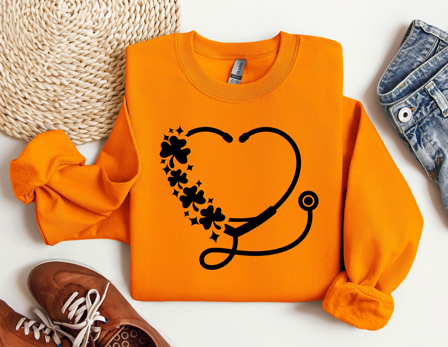 an orange shirt with a stethoscope on it