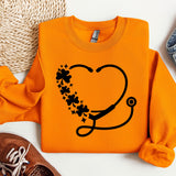 an orange shirt with a stethoscope on it