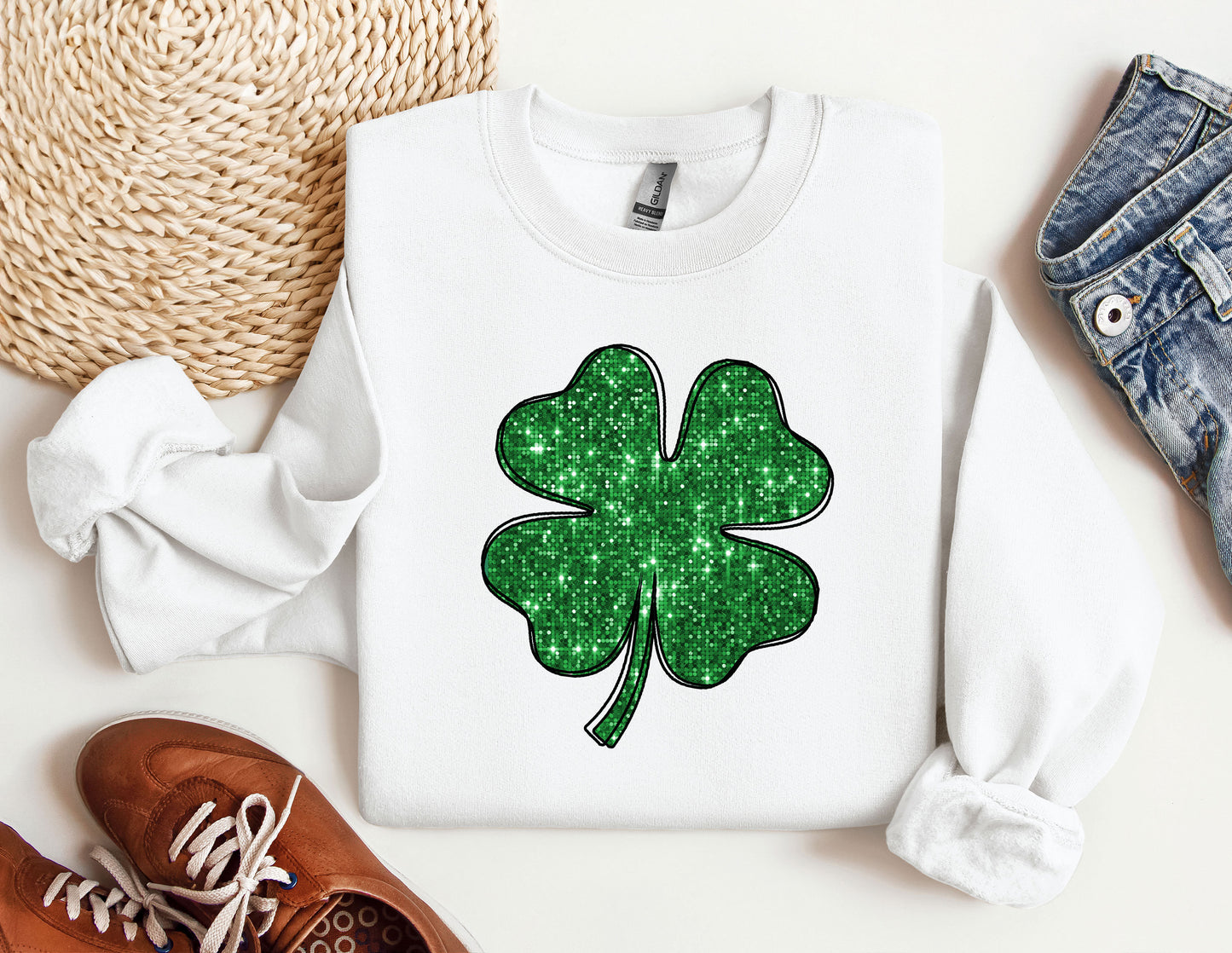 a white shirt with a green shamrock on it