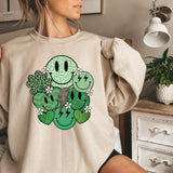 a woman wearing a sweatshirt with a smiley face on it