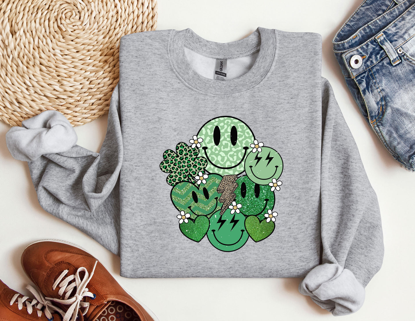 a sweater with a cartoon of a couple of cactuses on it