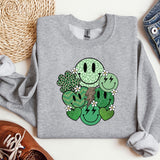 a sweater with a cartoon of a couple of cactuses on it