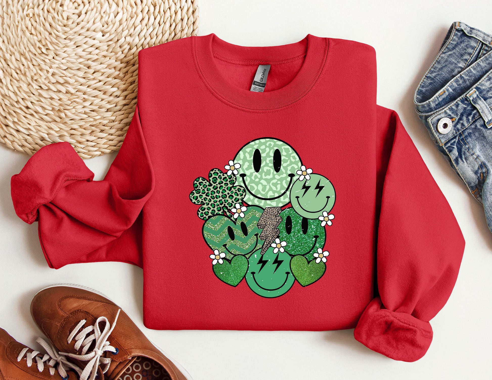 a red sweater with a green cactus on it