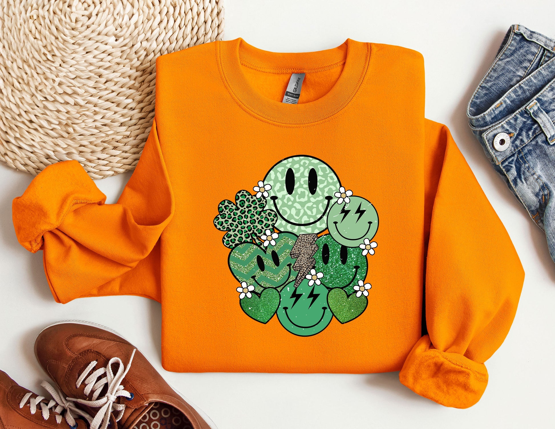 an orange shirt with a green cactus on it