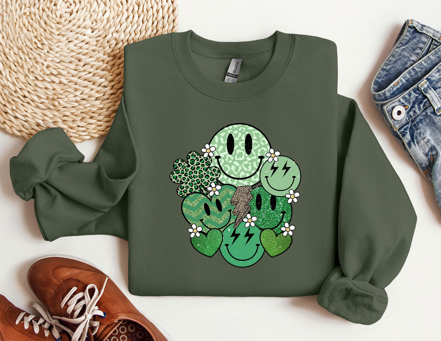 a green sweatshirt with a smiley face on it