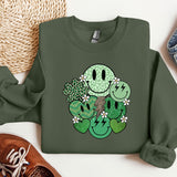 a green sweatshirt with a smiley face on it
