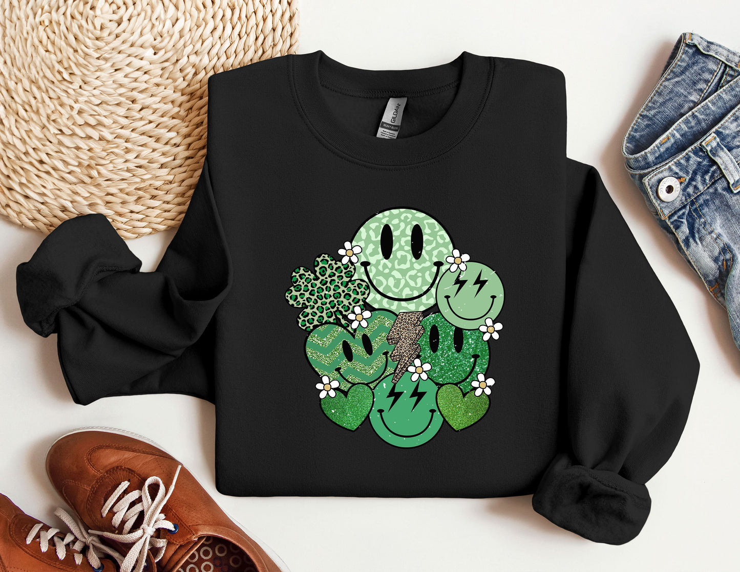 a black sweatshirt with a green smiley face on it