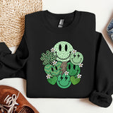 a black sweatshirt with a green smiley face on it