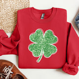 a red sweater with a green clover on it