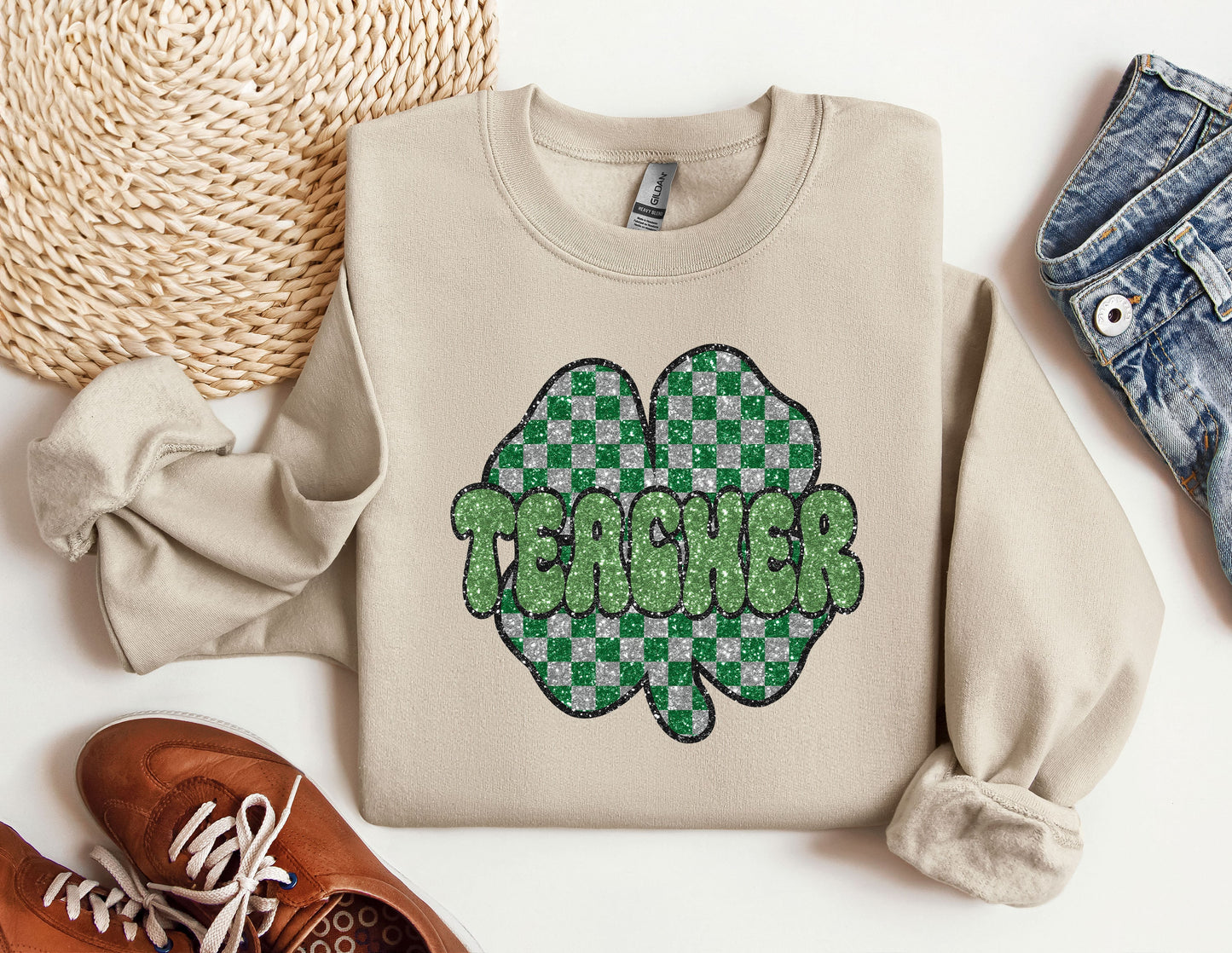 a pair of shoes and a sweater with a shamrock on it