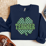 a blue sweatshirt with a green shamrock on it