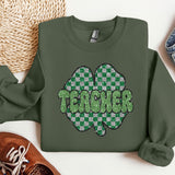 a green sweatshirt with the words teacher on it