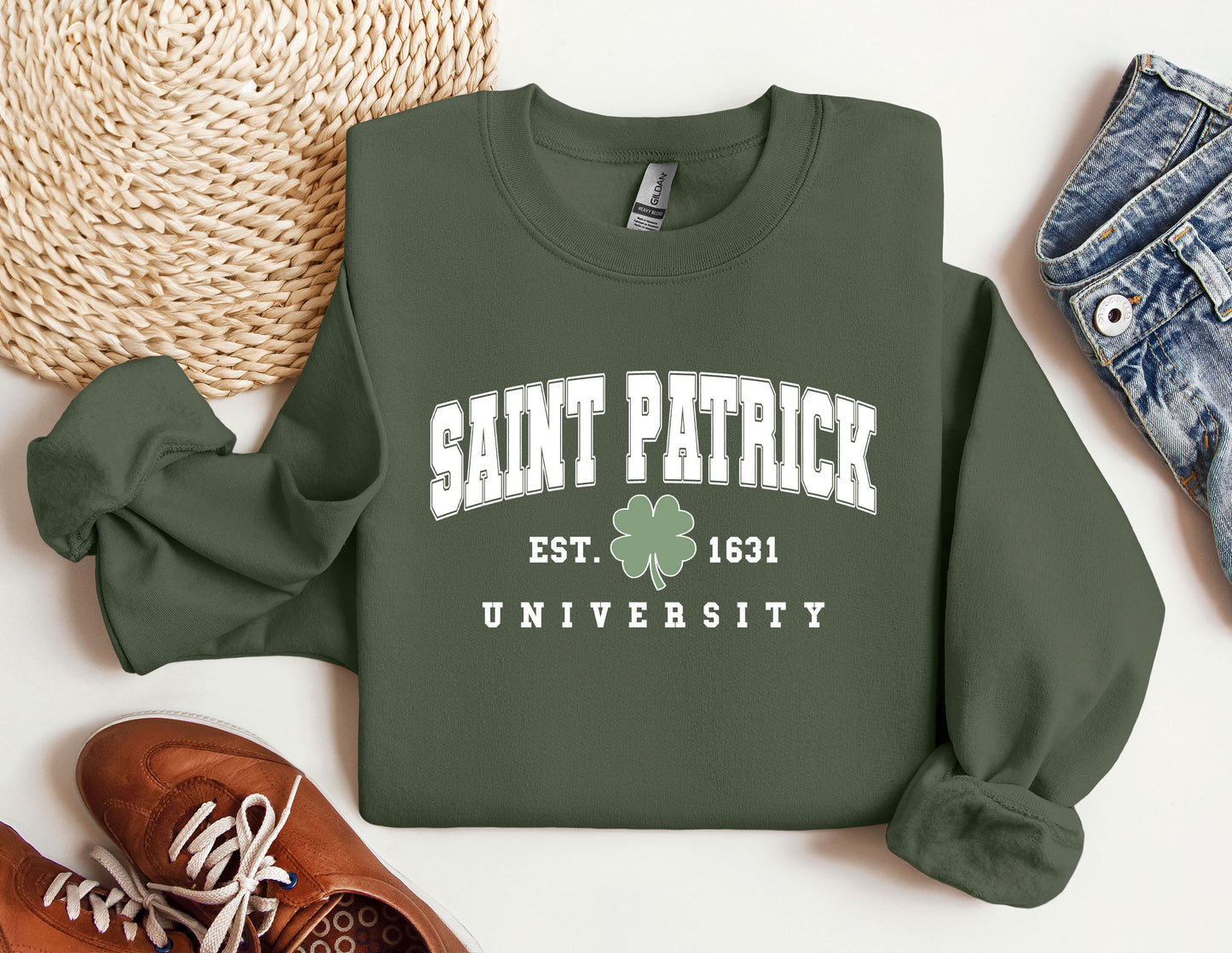 a sweatshirt with a shamrock on it next to a pair of shoes