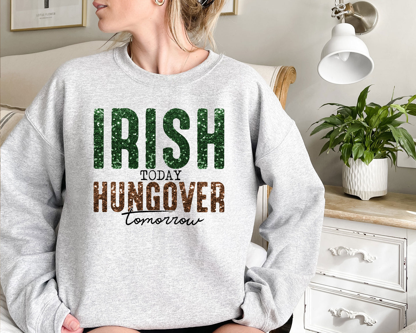 a woman wearing a sweatshirt that says irish today hungover tomorrow