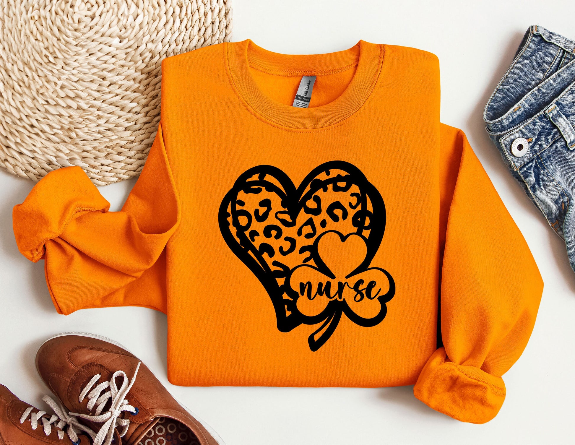 a pair of shoes and a sweater with a heart on it