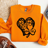 a pair of shoes and a sweater with a heart on it