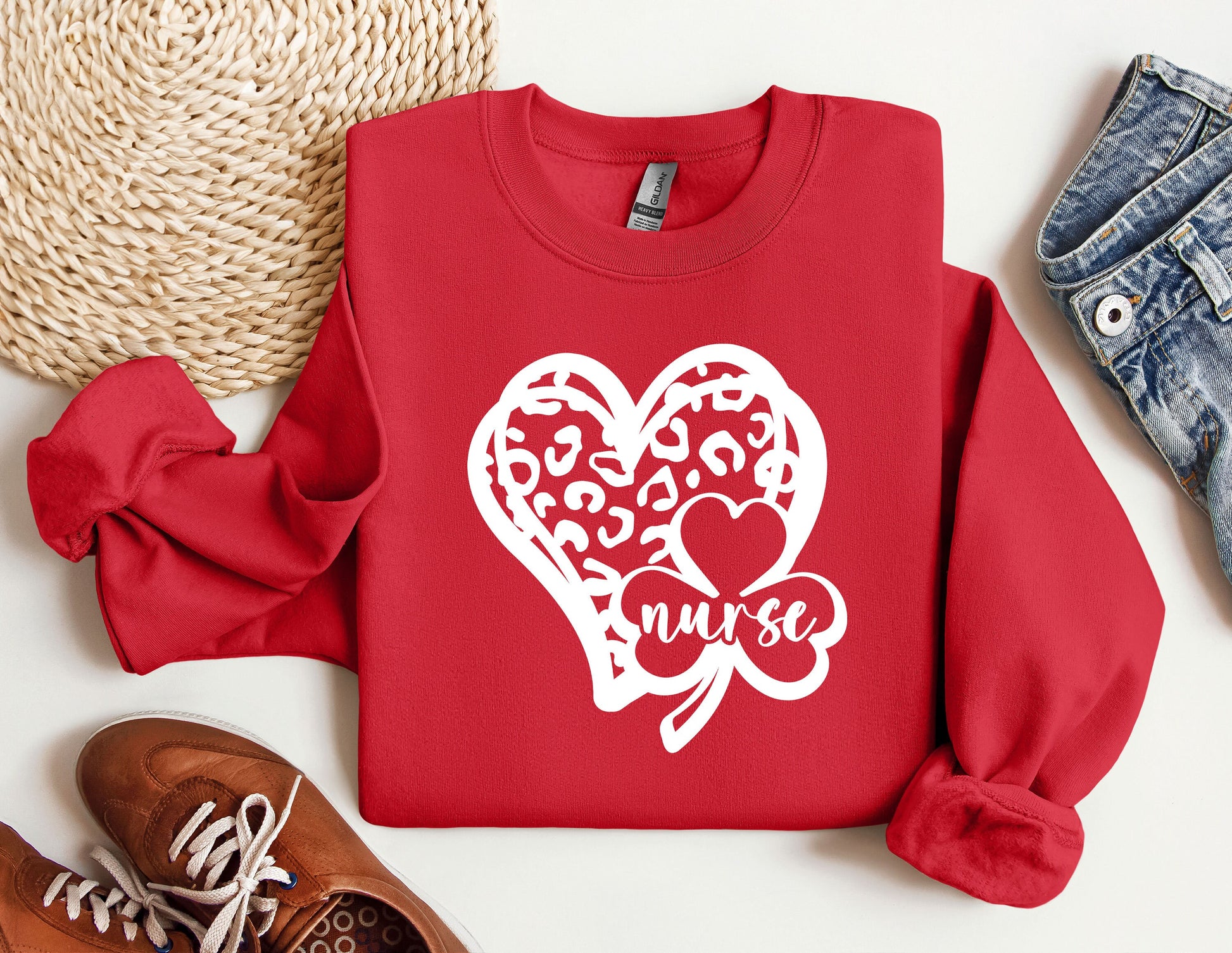 a red sweater with a heart and two hearts on it