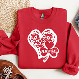 a red sweater with a heart and two hearts on it