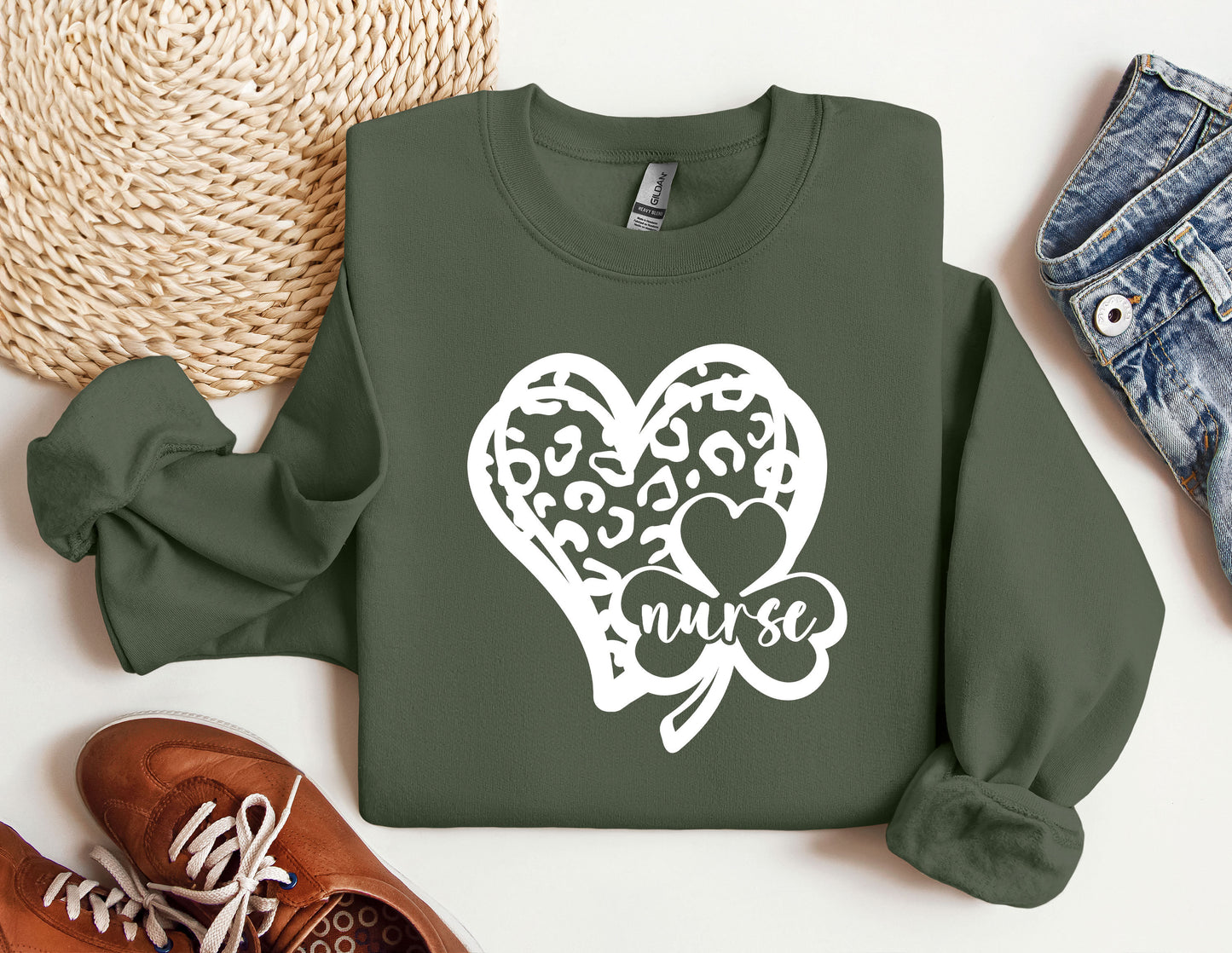 a green sweatshirt with a heart and a shamrock on it