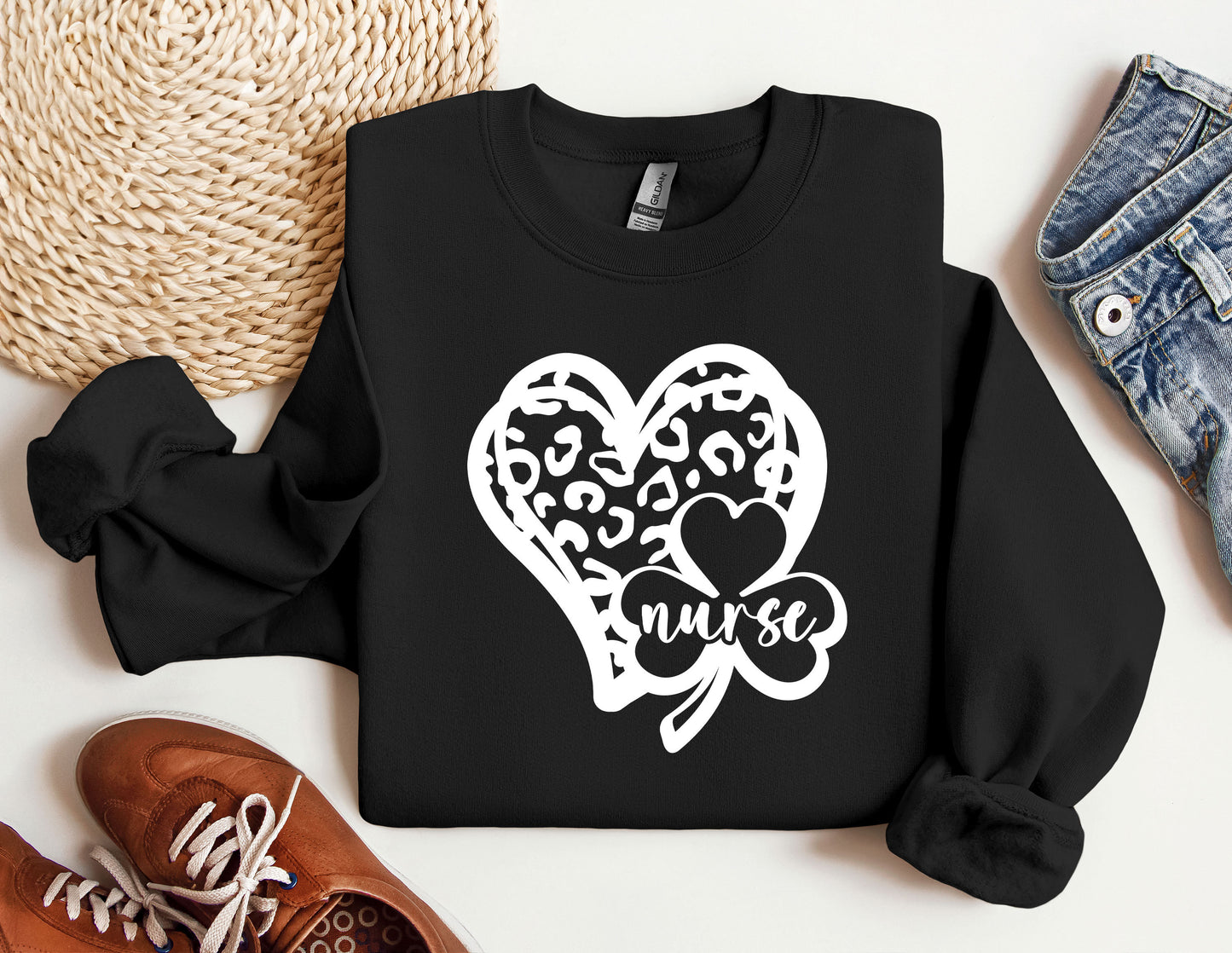 a black sweatshirt with a heart and a shamrock on it