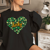 a woman sitting on a bed wearing a black shirt that says lucky