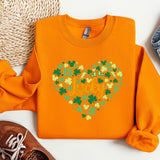 an orange sweater with a shamrock heart on it
