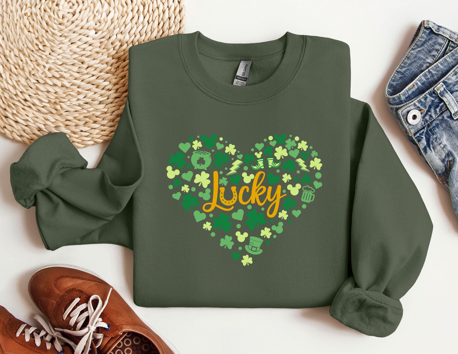 a green sweatshirt with a shamrock heart and the word lucky on it