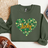 a green sweatshirt with a shamrock heart and the word lucky on it