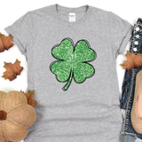 a st patrick's day t - shirt with a four leaf clover