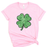 a pink t - shirt with a four leaf clover on it