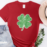 a red shirt with a green shamrock on it