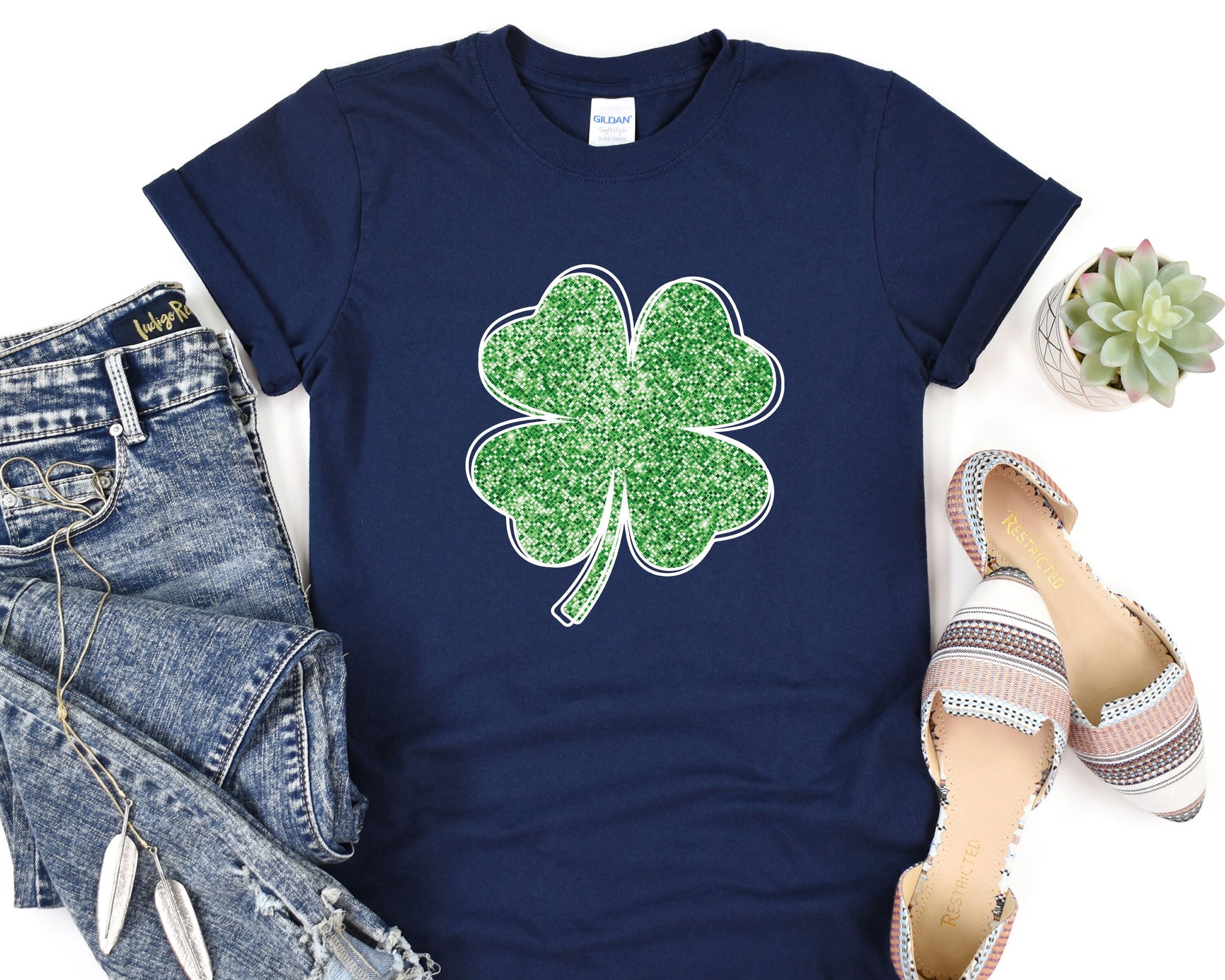 a t - shirt with a four leaf clover on it